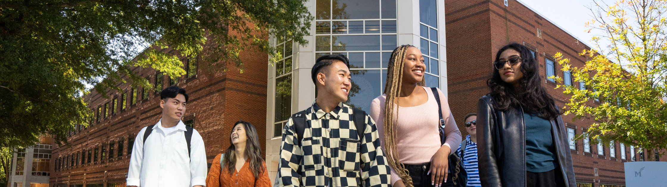 Photo of George Mason University students in front of the Johnson Center