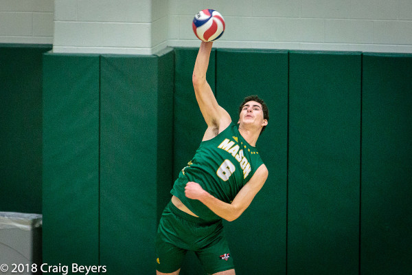 Photograph of Sam Greenslade hitting a volleyball