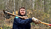 Brenden Powers holding a tool
